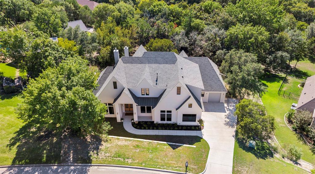 Nestled on .81 acre heavily treed lot