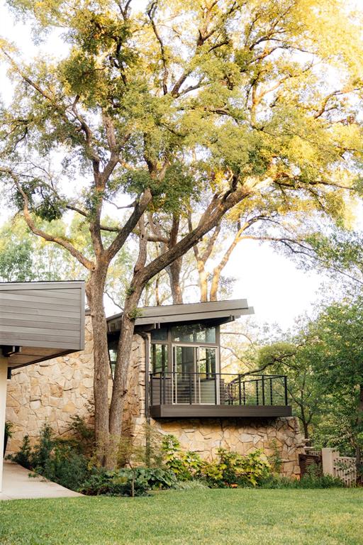 The treehouse room from outside, tucked under mature oak trees The treehouse room from outside, tucked under mature oak trees