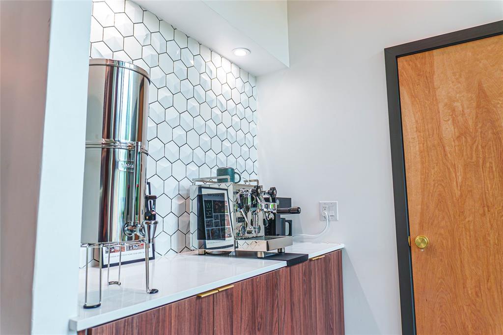 Coffee bar with custom cabinetry and designer backsplash