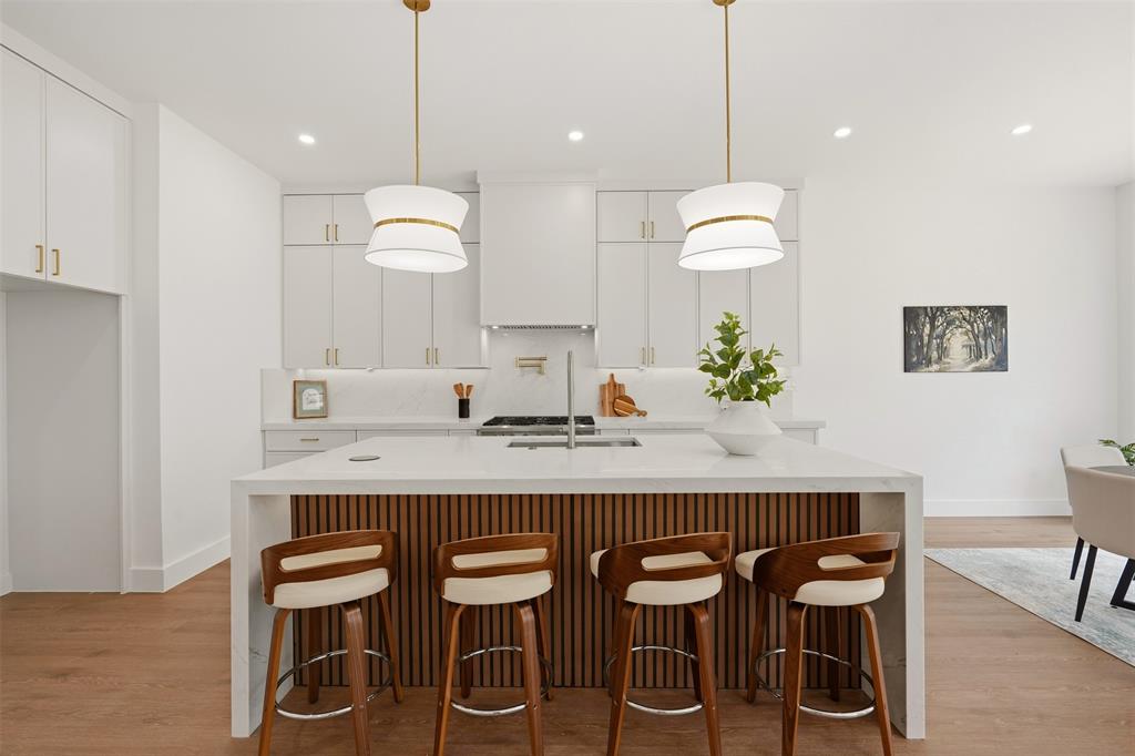 Kitchen island with a white countertop and wood-finish paneling