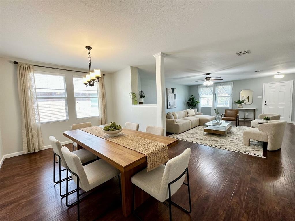 Wood-finish flooring extends throughout the dining area and living space,virtal staged