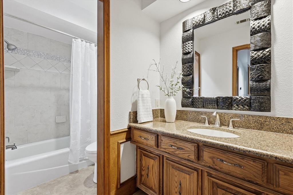 3rd Full Bath- located in hall outside den and kitchen
