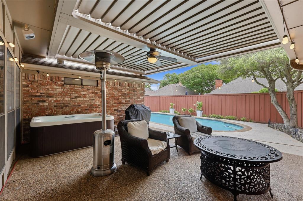 patio with levered roof, hot tub that will come with the home and pool