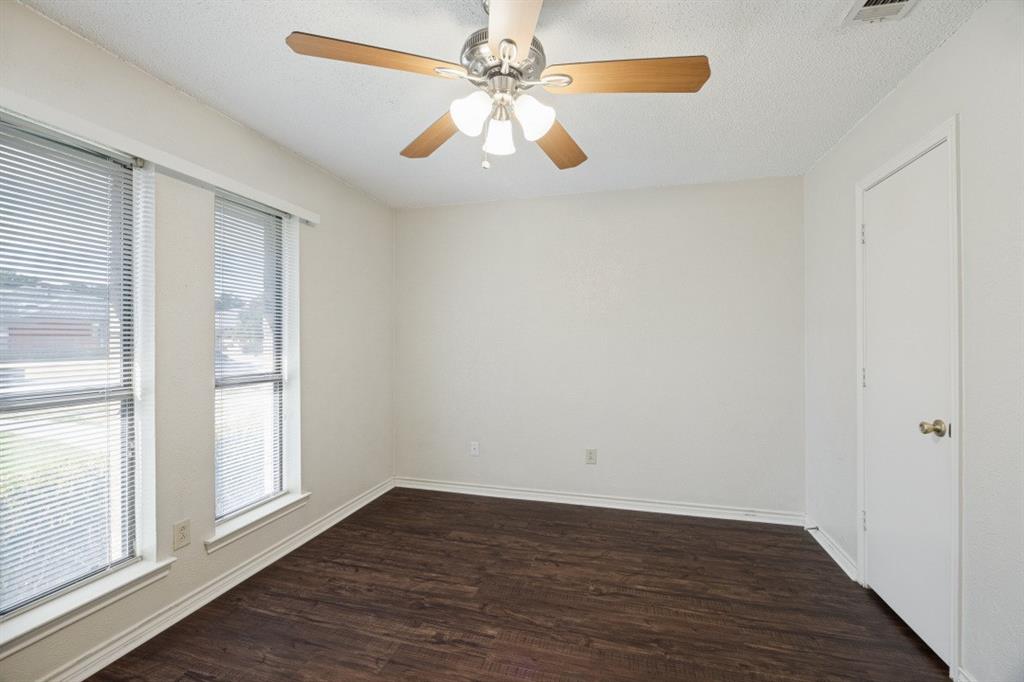 Secondary bedrooms all feature a ceiling fan and nice flooring!