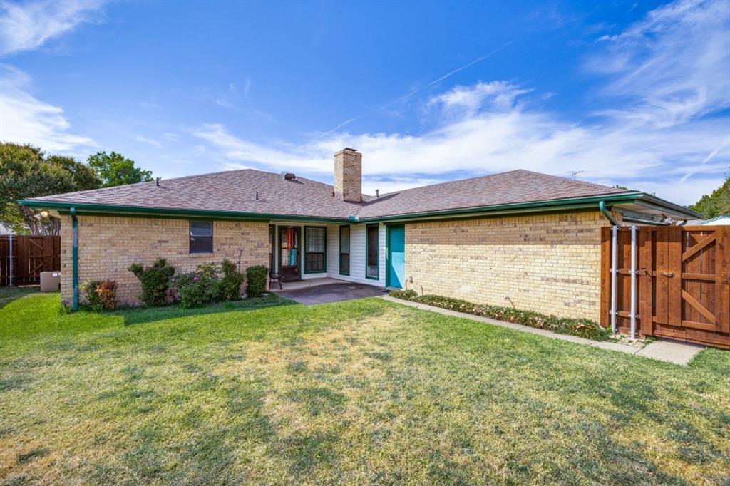 Fence leads to the driveway and back entranced garage.