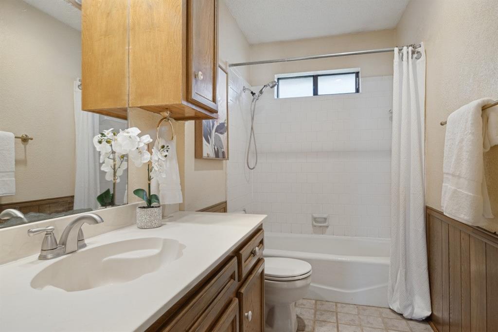 The hall bathroom is conveniently located between bedrooms 2 and 3.