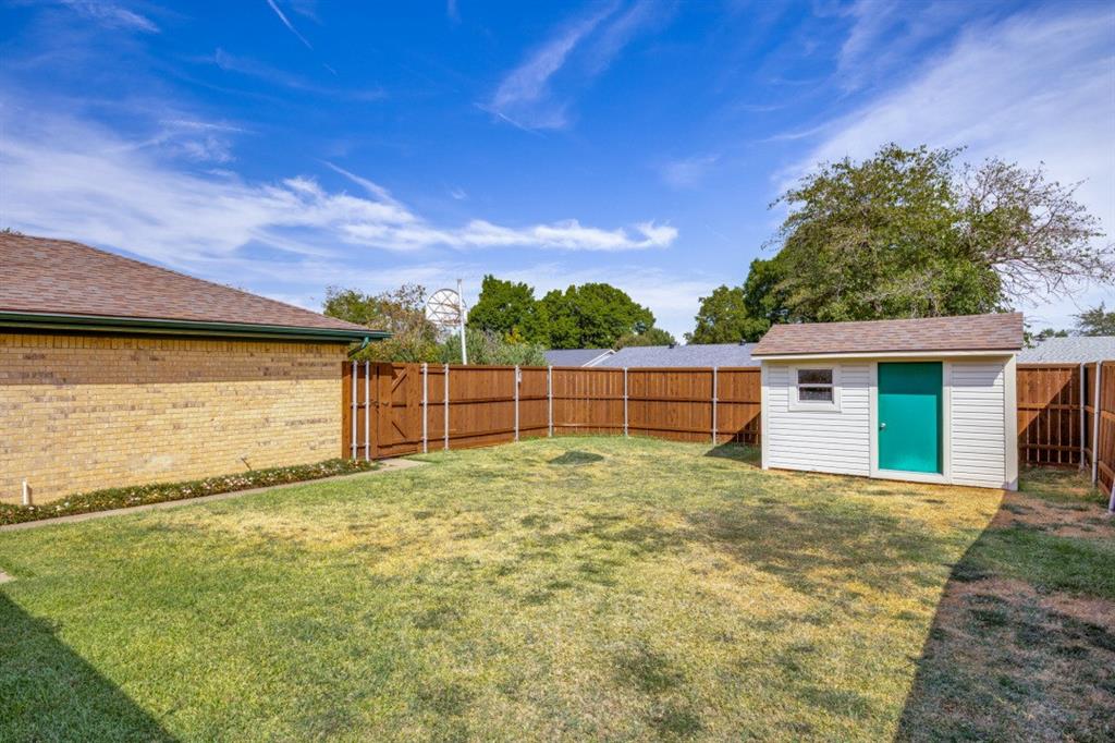 Nice wood fence encloses the perfect sized backyard!