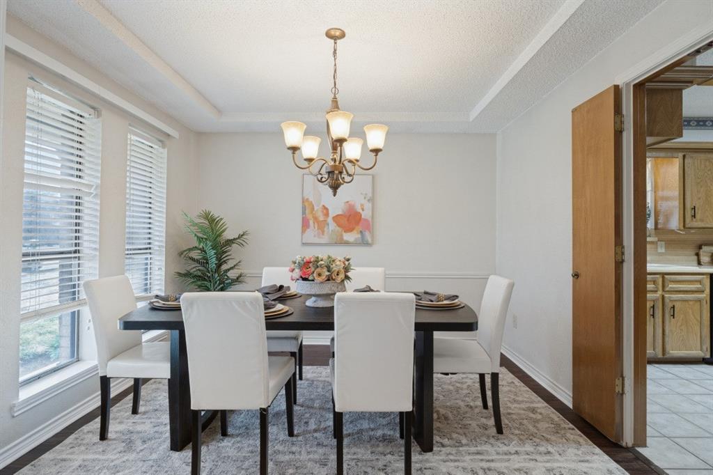The dining room is in the front of the home, off of the entry and connected to the kitchen. Freshly painted!