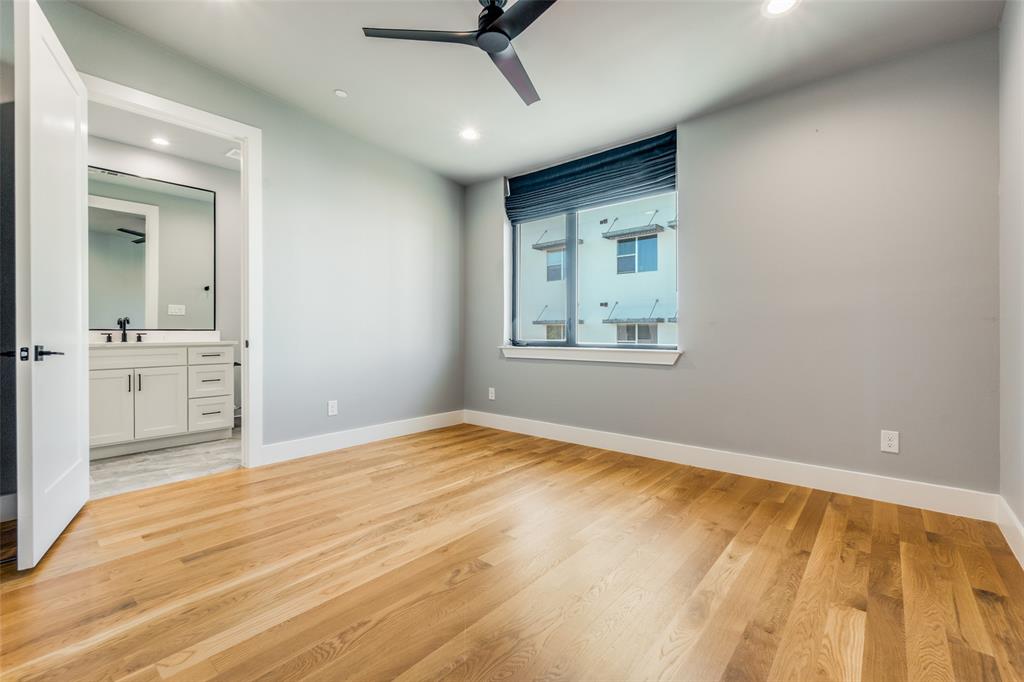 Hardwood flooring, recessed lighting, and ceiling fan