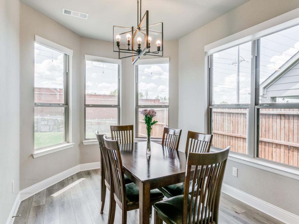 Sun filled breakfast nook nestled off the kitchen