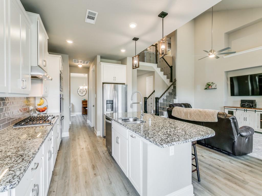 This beautiful kitchen features custom cabinets including built-in spice drawers!