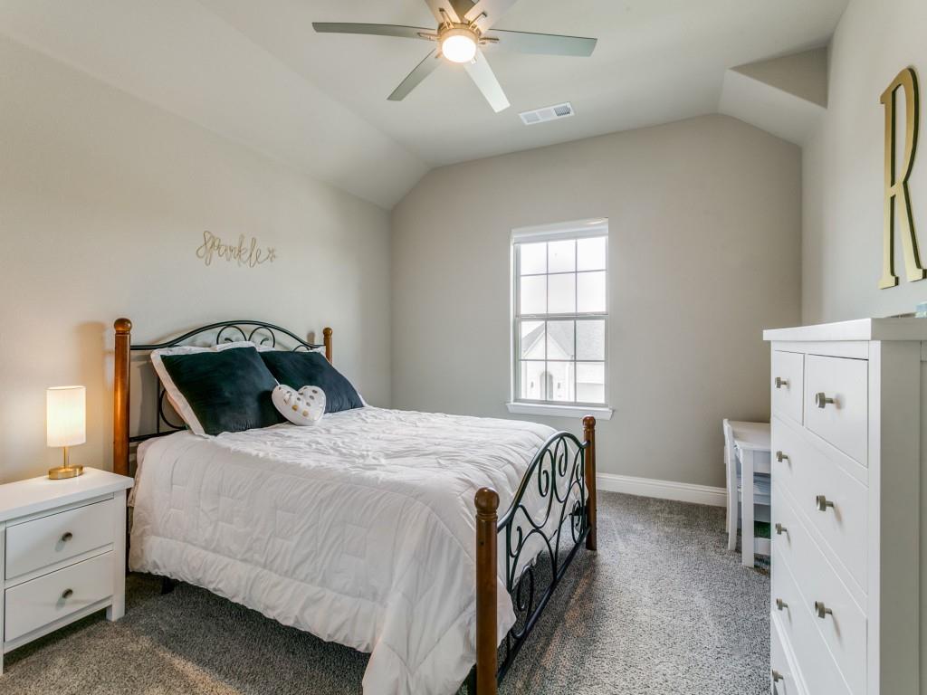 Another bedroom with walk-in closet and access to walk-in attic space