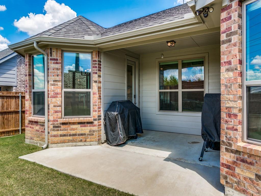 Extended covered patio in this private backyard
