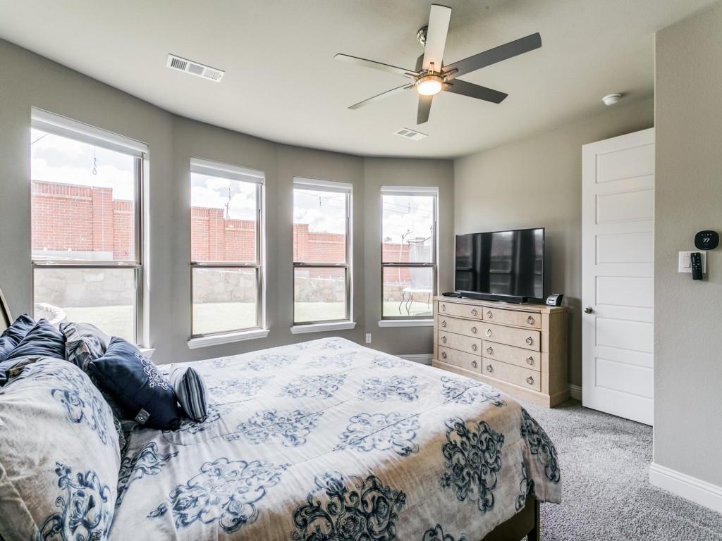 Gorgeous over-sized primary bedroom with plenty of natural light