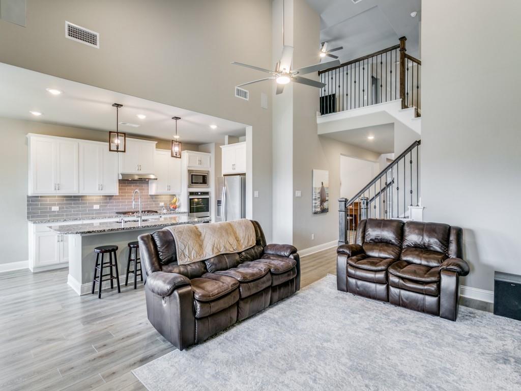 Spacious living area with sweeping ceilings and open concept