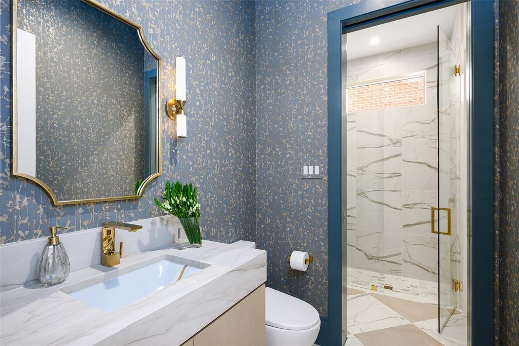 Downstairs powder room with designer wall covering wall covering