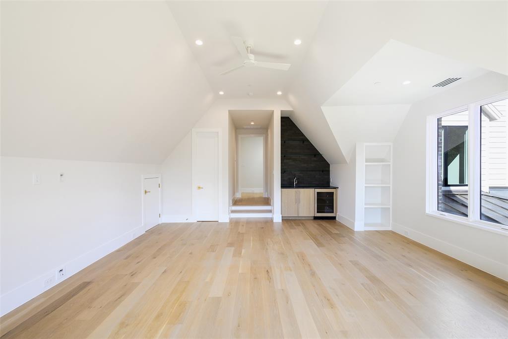 Oversized game room with spacious closet and separate overflow storage
