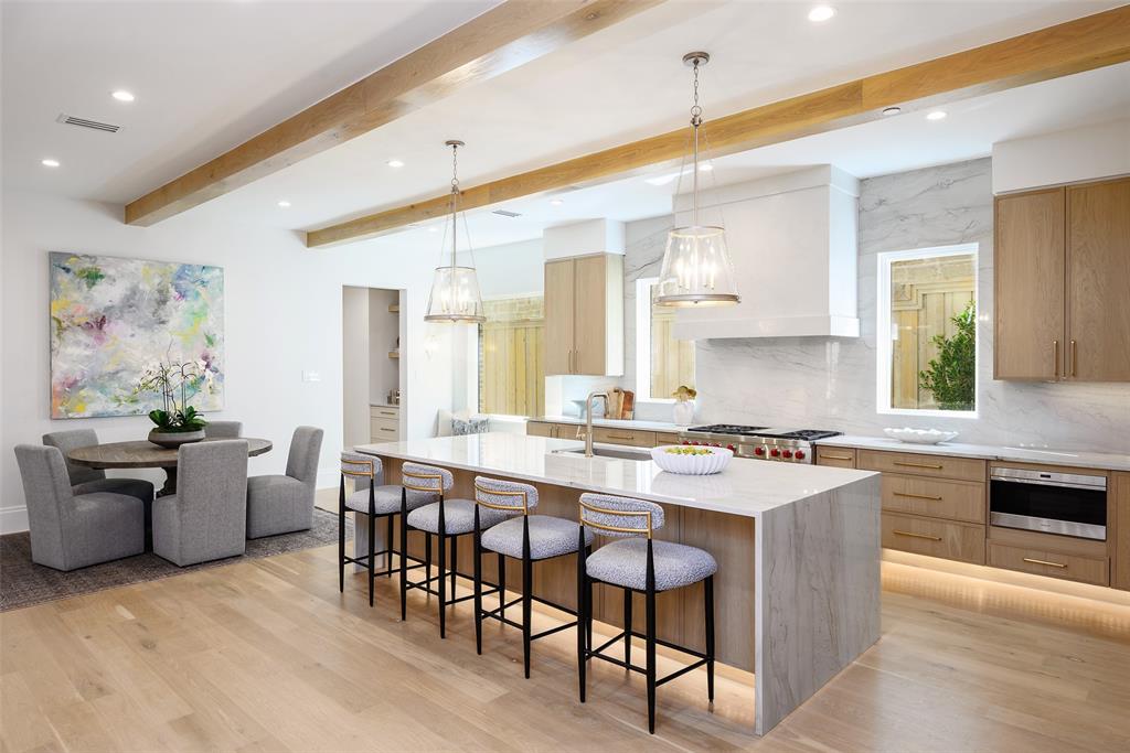 Breakfast room area features accent lighting, window seat and overflow storage