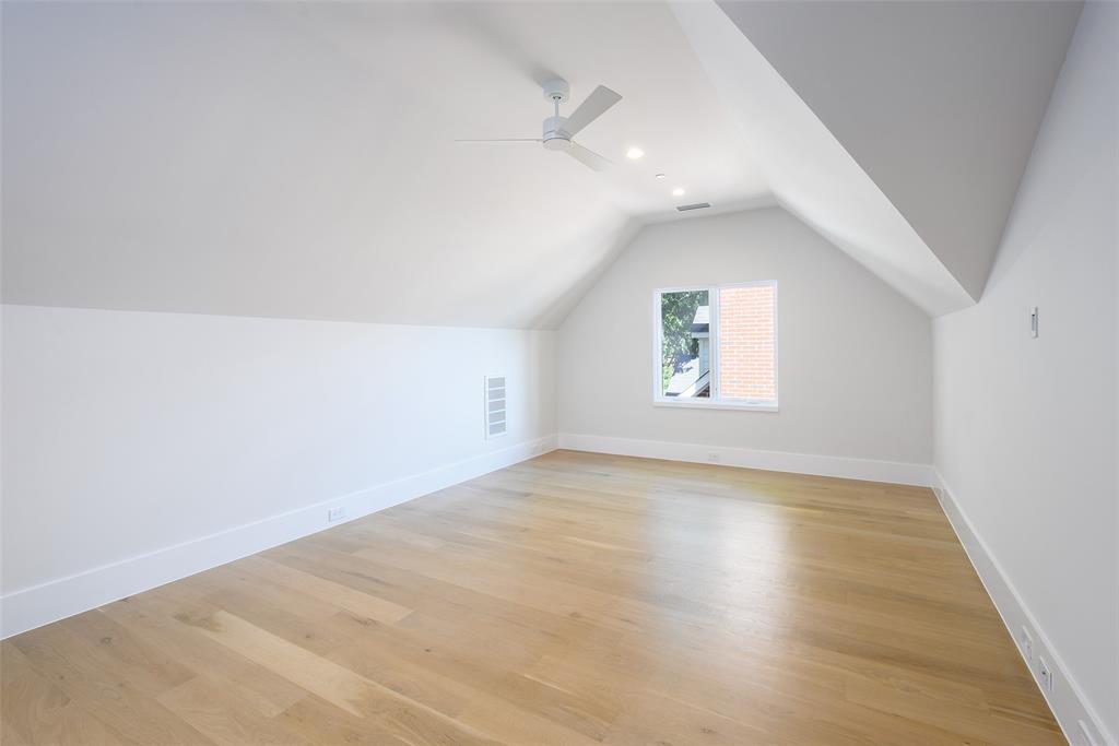 Third floor bedroom/media room with full bath and walk-in closet