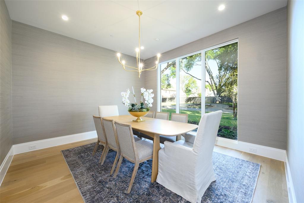 Formal dining room with designer wall covering