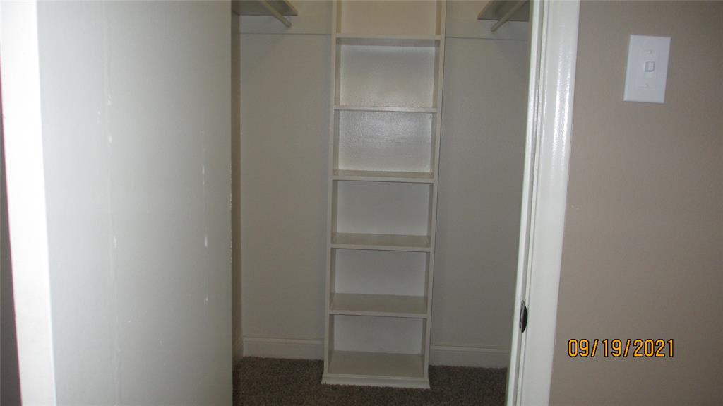 Walk in closet has shelves Walk in closet has shelves