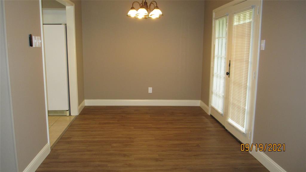 Dining room has French doors to back yard