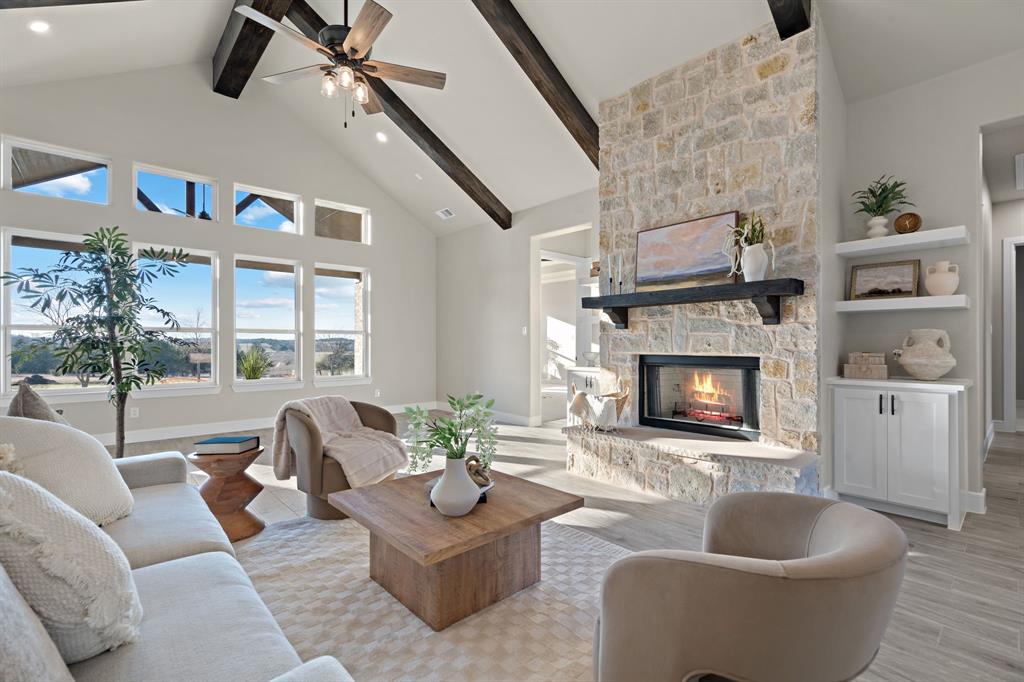Floor to ceiling stone fireplace .