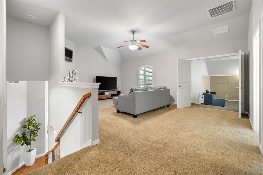 Upstairs gameroom or additional living space.