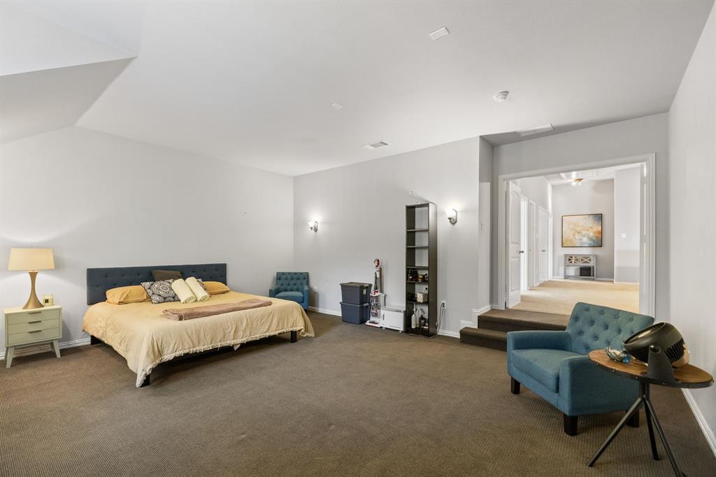 Currently set as a bedroom, this is a large media room ready for movie watching.
