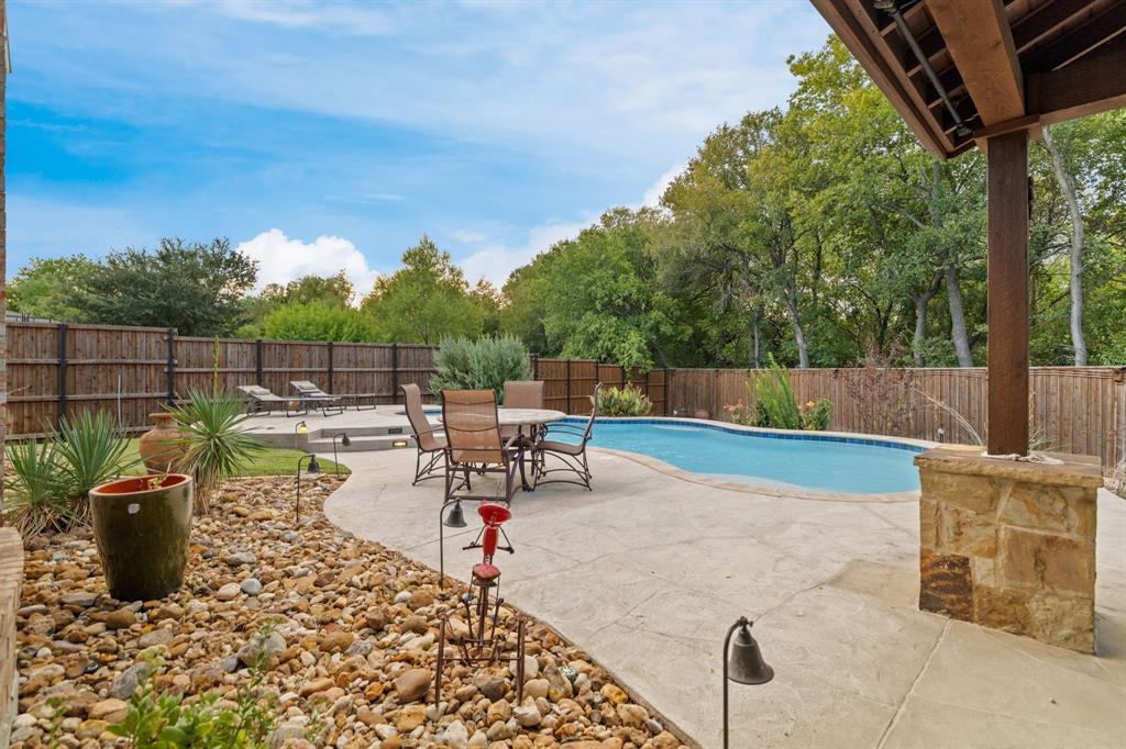 The outside of this home is a show stopper as it backs to a greenbelt.