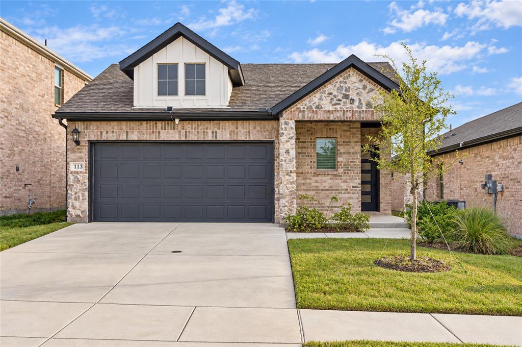 Brick and stone exterior with dark trim accents