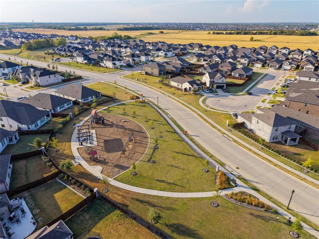 Neighborhood featuring an integrated park space, paved roads, and sidewalks