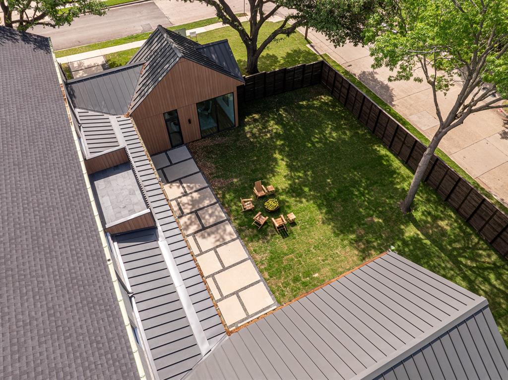 Set beneath a canopy of mature oaks and showcasing striking modern design.