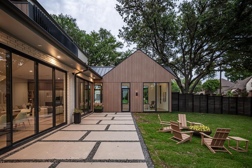 Expansive glass and thoughtful design create a seamless connection to the backyard.