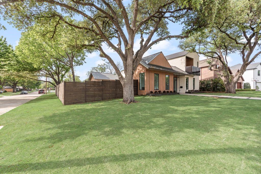 The exterior showcases clean architectural lines and a striking standing seam metal roof The exterior showcases clean architectural lines and a striking standing seam metal roof