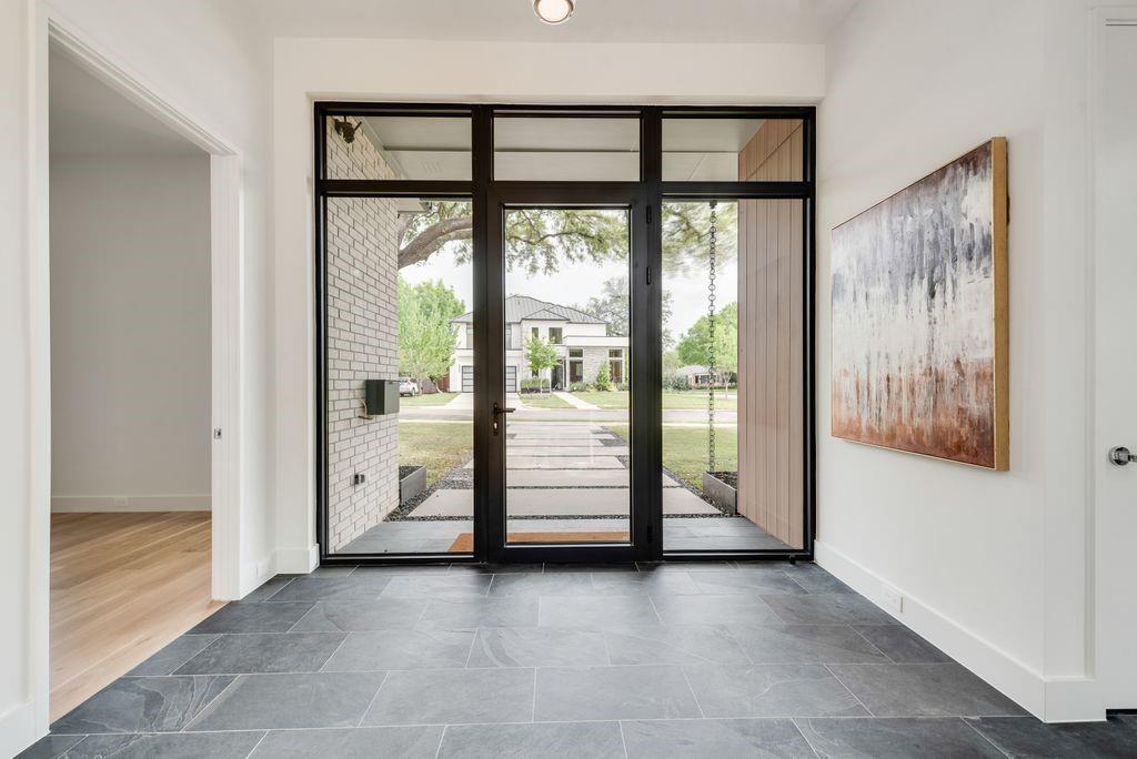 The foyer is filled with natural light, creating a calm and inviting first impression. The foyer is filled with natural light, creating a calm and inviting first impression.