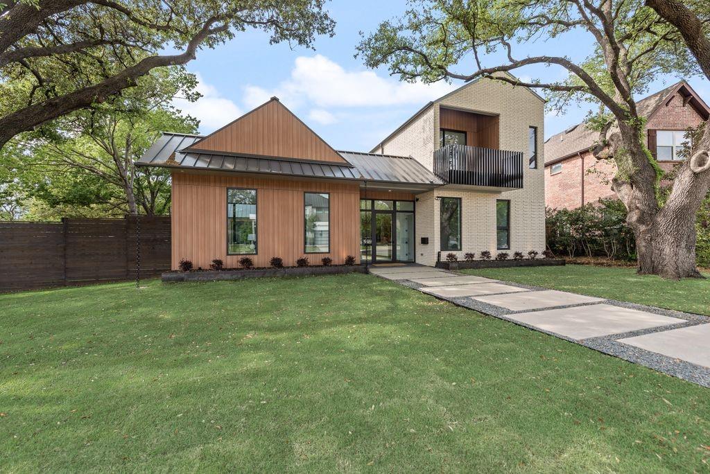 A thoughtful blend of brick and board & batten siding creates depth and visual interest. A thoughtful blend of brick and board & batten siding creates depth and visual interest.