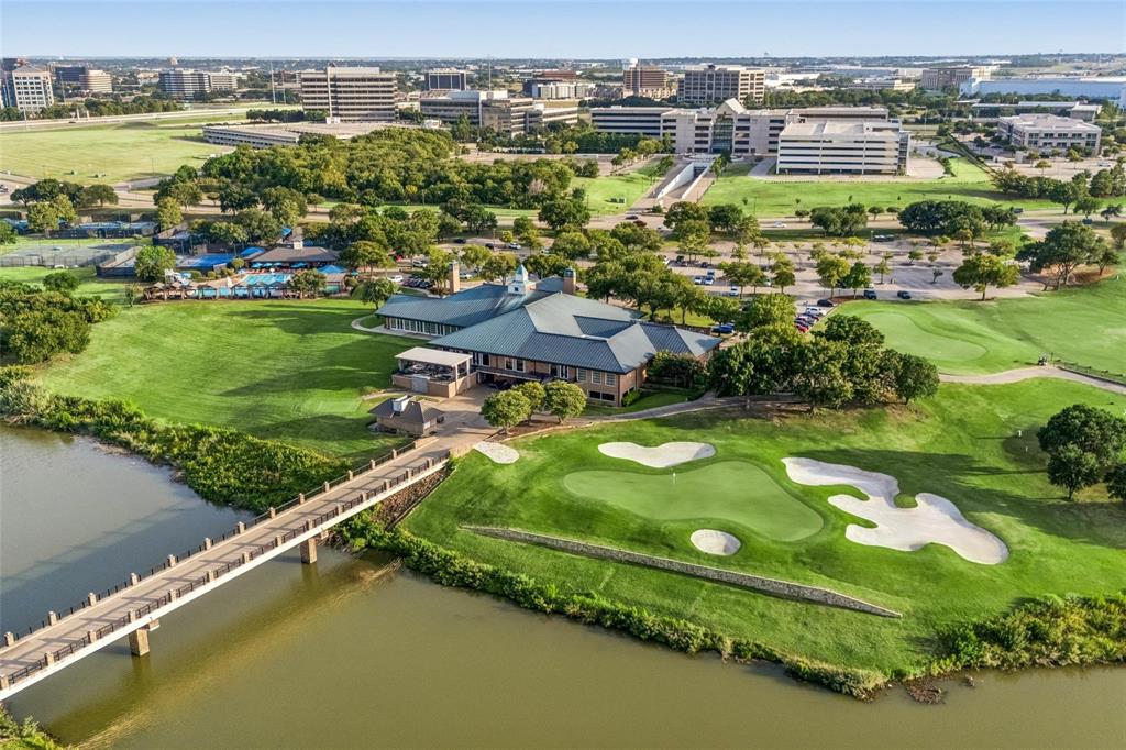 Golf course with green fairways, sand traps, and a putting green