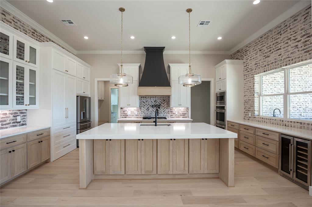 Kitchen with White Oak cabinets, and a beverage fridge. Kitchen with White Oak cabinets, and a beverage fridge.