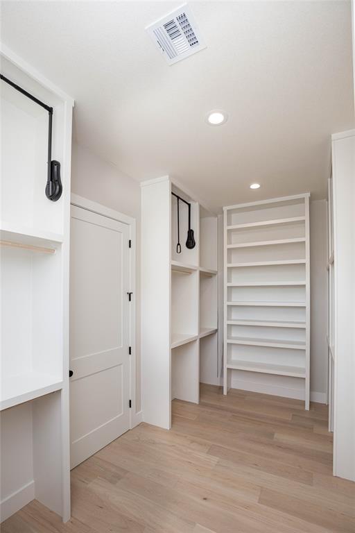 tons of space for shoes or bags...plus it opens to laundry room!!