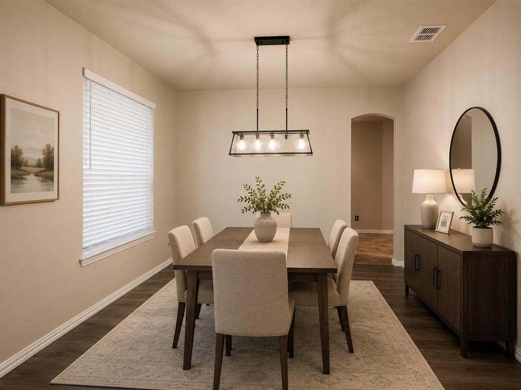 Recessed lighting, wood-finish flooring, and an arched doorway