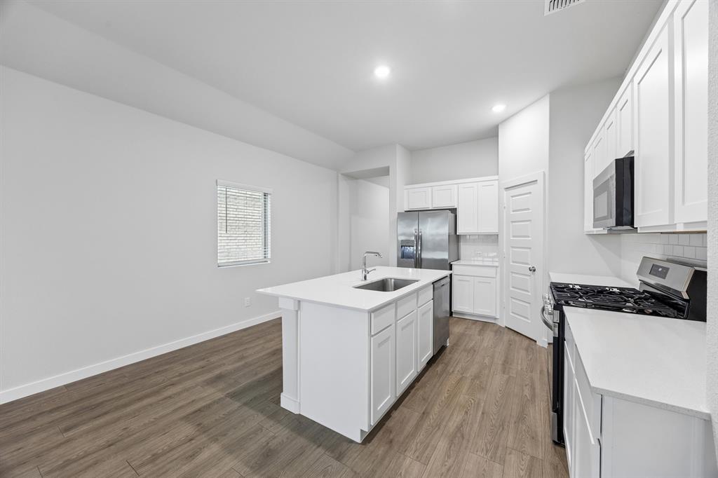 Kitchen in the Cedar home plan – REPRESENTATIVE PHOTO