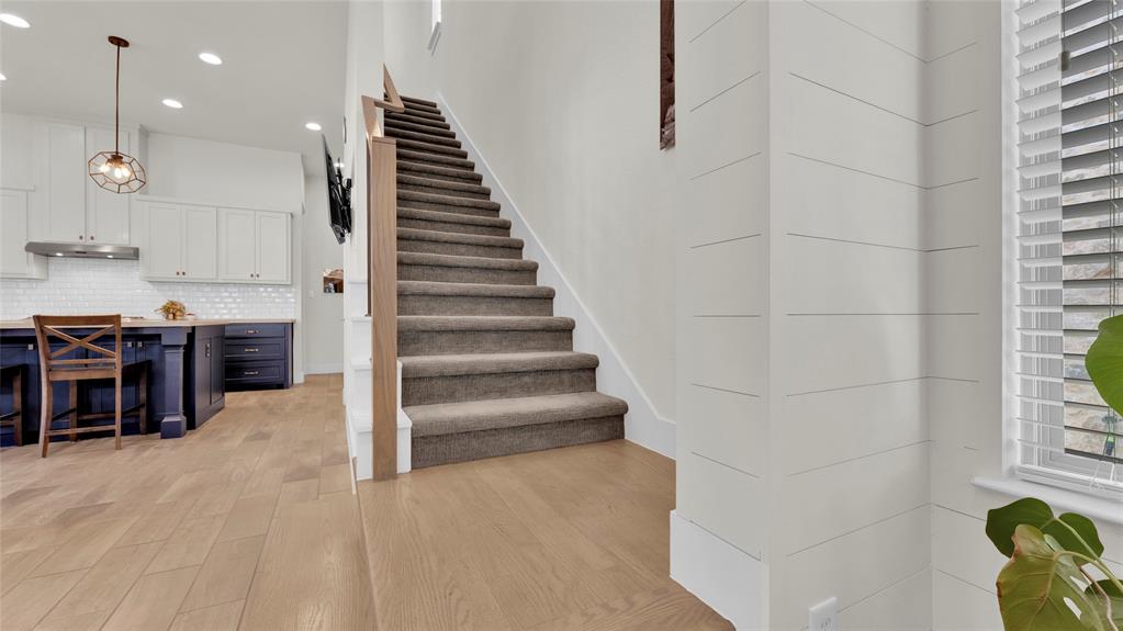 Stairs leading up to floor 2 from living and kitchen area.
