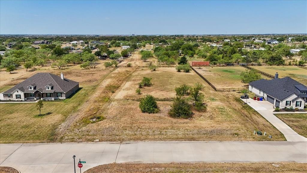 Expansive undeveloped lot featuring a paved road frontage