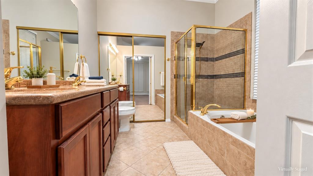 Dual vanity with gold-finish fixtures and an integrated countertop
