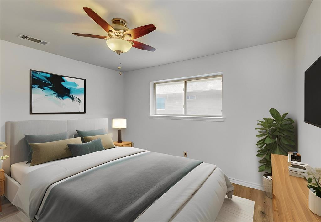 Overhead ceiling fan with integrated lighting, window with roller shade, wood-finish flooring, wall-mounted television