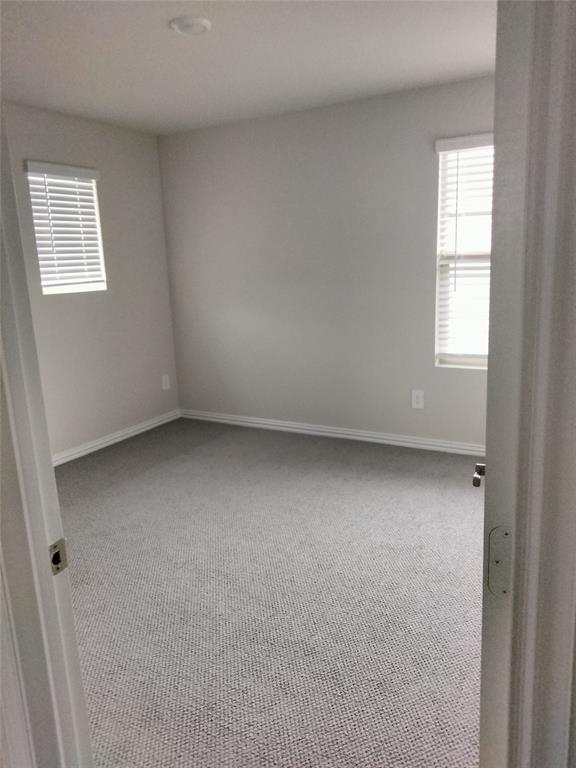 Neutral-toned wall paint and textured carpeting