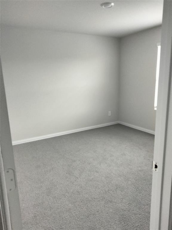 Wall-to-wall carpeting, window with natural light, recessed ceiling lighting