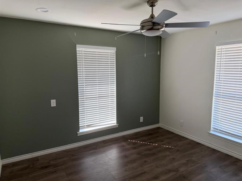 Recessed ceiling light, contemporary ceiling fan, wood-finish flooring, and window blinds