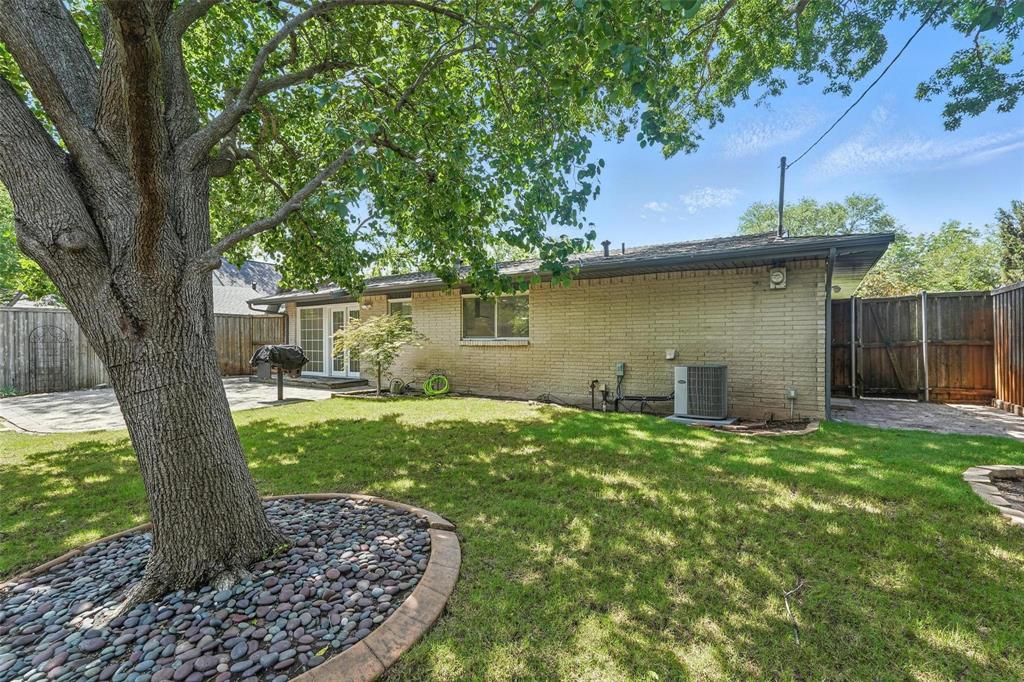 Large fenced yard with sprinkler system
